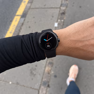 A runner's own view of the Veyra on his wrist, over the pavement